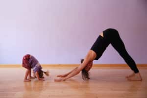 mother and child in yoga poses